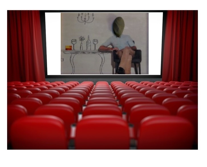 Se ve una sala de cine con las sillas vacías. Empieza la película.